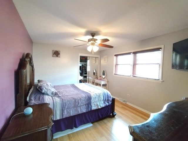 1173 Lucas St, Calumet City, IL 60409 - bedroom featuring light wood-style flooring, a ceiling fan, and baseboards
