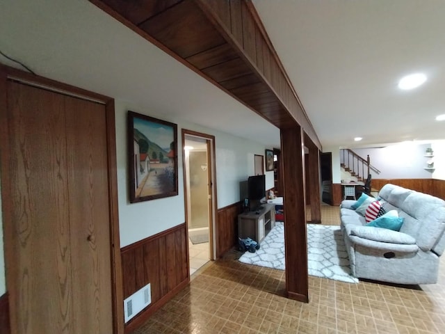 1173 Lucas St, Calumet City, IL 60409 - living area with a wainscoted wall, wooden walls, stairway, and recessed lighting