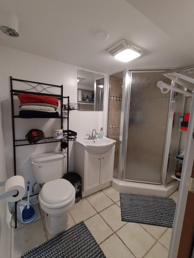 1173 Lucas St, Calumet City, IL 60409 - bathroom with tile patterned flooring, a shower stall, toilet, and vanity