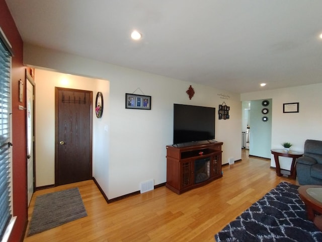 1173 Lucas St, Calumet City, IL 60409 - living room with light wood-style flooring, recessed lighting, and baseboards