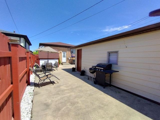 1173 Lucas St, Calumet City, IL 60409 - view of patio / terrace with outdoor dining area, a fenced backyard, and a grill
