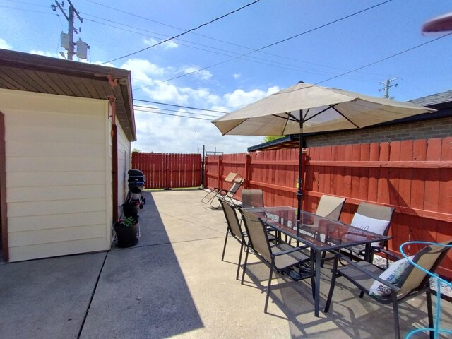 1173 Lucas St, Calumet City, IL 60409 - view of patio / terrace with outdoor dining area and a fenced backyard