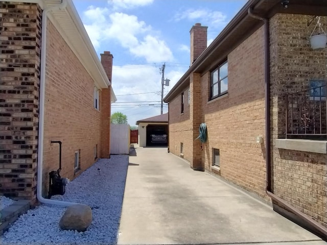1173 Lucas St, Calumet City, IL 60409 - view of side of home featuring brick siding and a chimney