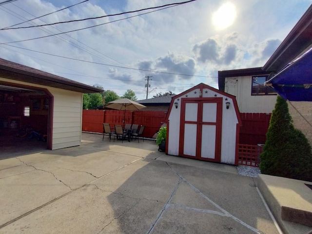 1173 Lucas St, Calumet City, IL 60409 - view of shed featuring outdoor dining area and fence
