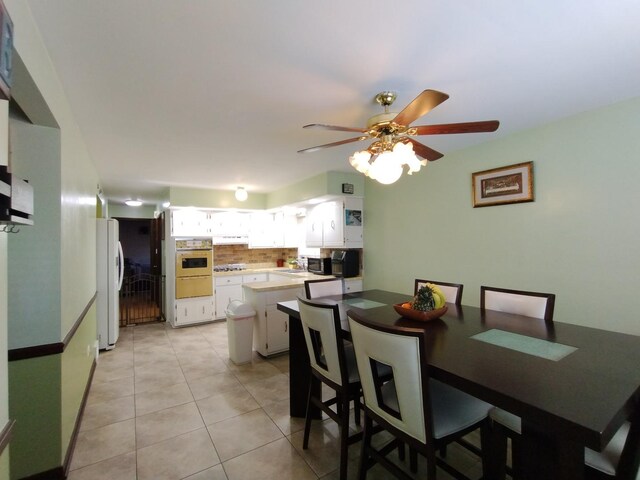 1173 Lucas St, Calumet City, IL 60409 - dining area with a ceiling fan and light tile patterned floors