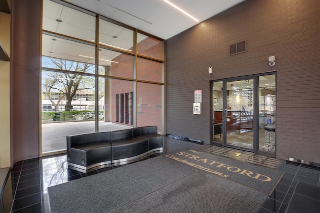 2605 S Indiana Ave Unit 402, Chicago, IL 60616 - community lobby with a towering ceiling, brick wall, and a water view