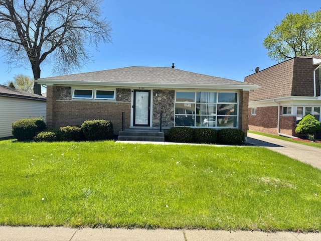 8344 N Milwaukee Ave, Niles, IL 60714 - view of front facade featuring brick siding and a front yard