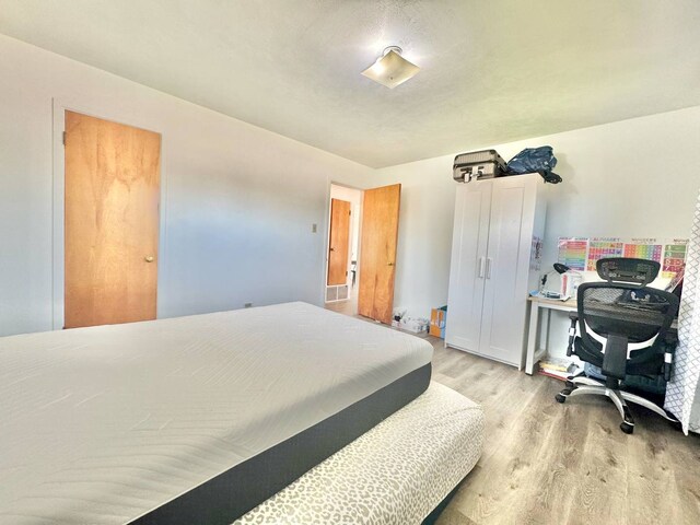 8344 N Milwaukee Ave, Niles, IL 60714 - bedroom with wood finished floors and an office area