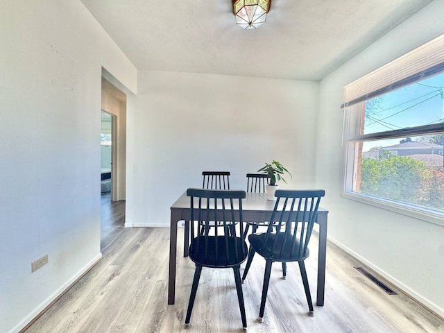 8344 N Milwaukee Ave, Niles, IL 60714 - dining area with wood finished floors and baseboards