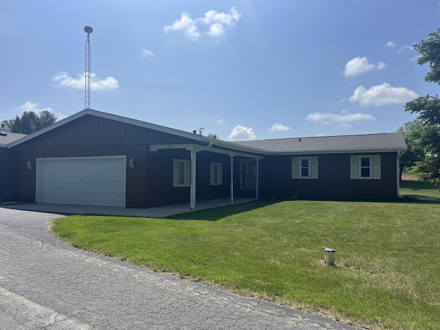 7427 Mccurry Rd, Roscoe, IL 61073 - ranch-style home with an attached garage and a front lawn