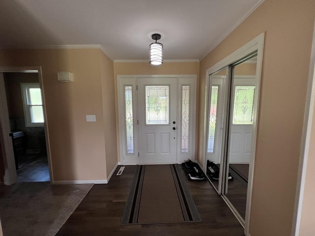 7427 Mccurry Rd, Roscoe, IL 61073 - entrance foyer featuring plenty of natural light, dark wood-type flooring, ornamental molding, and baseboards