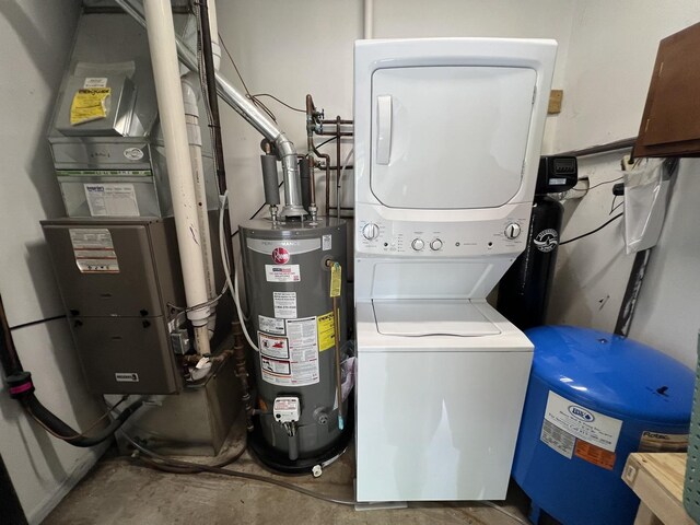 7427 Mccurry Rd, Roscoe, IL 61073 - washroom featuring stacked washing machine and dryer, water heater, and heating unit