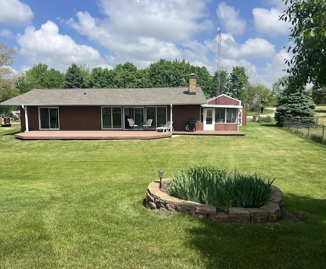 7427 Mccurry Rd, Roscoe, IL 61073 - rear view of property featuring a chimney, a deck, a sunroom, and roof with shingles