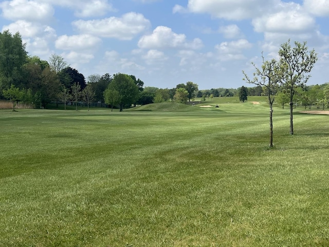 7427 Mccurry Rd, Roscoe, IL 61073 - surrounding community with view of golf course, a lawn, and view of scattered trees