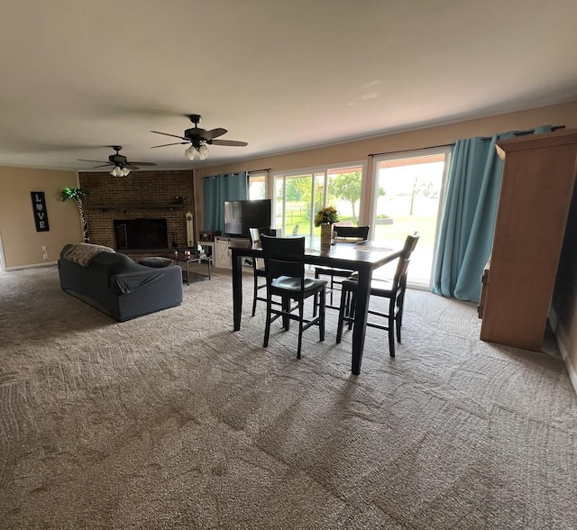7427 Mccurry Rd, Roscoe, IL 61073 - dining space with light colored carpet, a brick fireplace, and ceiling fan