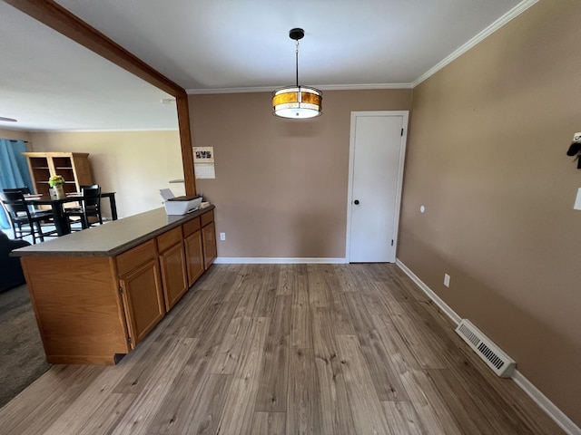 7427 Mccurry Rd, Roscoe, IL 61073 - dining area with wood finished floors, crown molding, and baseboards