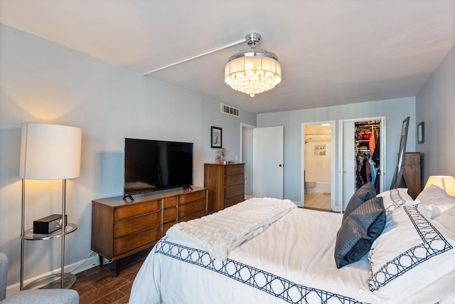 6033 N Sheridan Rd Unit 21D, Chicago, IL 60660 - bedroom featuring a chandelier, dark wood-style floors, baseboards, a spacious closet, and a closet