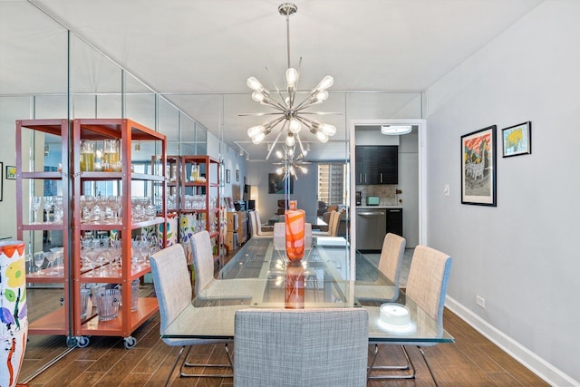 6033 N Sheridan Rd Unit 21D, Chicago, IL 60660 - dining area with a chandelier, wood finished floors, and baseboards
