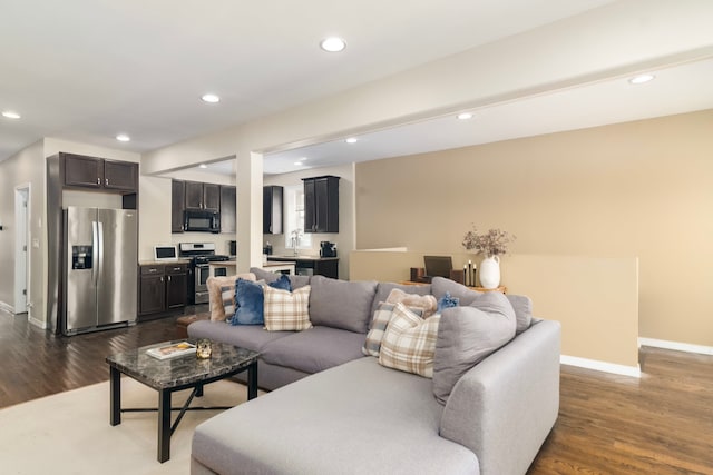 4639 S Saint Lawrence Ave Unit 2, Chicago, IL 60653 - living room with dark wood-style flooring, baseboards, and recessed lighting