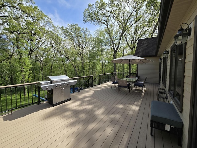 24-114 Lake Carroll Blvd, Lake Carroll, IL 61046 - wooden deck featuring area for grilling and outdoor dining area