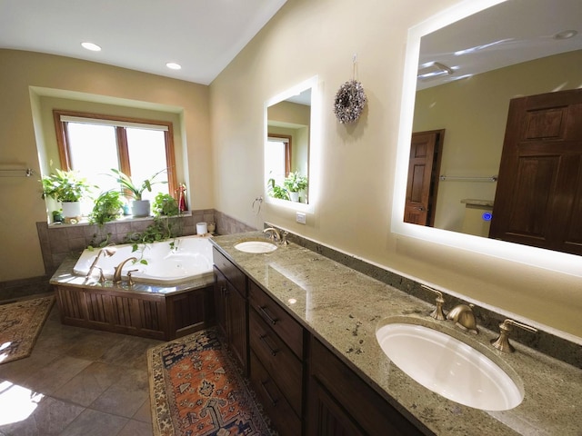 24-114 Lake Carroll Blvd, Lake Carroll, IL 61046 - bathroom featuring a garden tub, double vanity, tile patterned floors, and recessed lighting