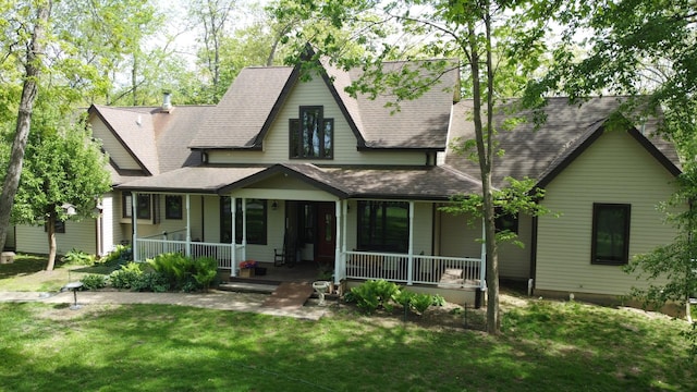 24-114 Lake Carroll Blvd, Lake Carroll, IL 61046 - view of front of property with a porch, a front yard, and a shingled roof