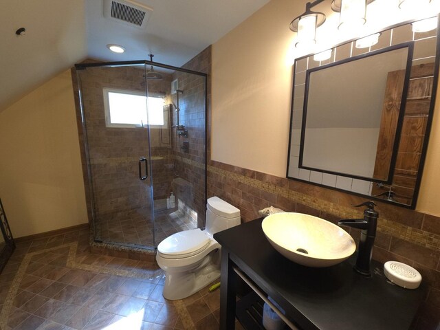 24-114 Lake Carroll Blvd, Lake Carroll, IL 61046 - full bath featuring tile walls, a shower stall, vanity, toilet, and tile patterned floors