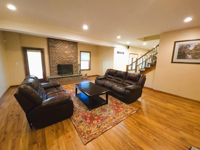 24-114 Lake Carroll Blvd, Lake Carroll, IL 61046 - living room with wood finished floors, stairway, healthy amount of natural light, a brick fireplace, and recessed lighting