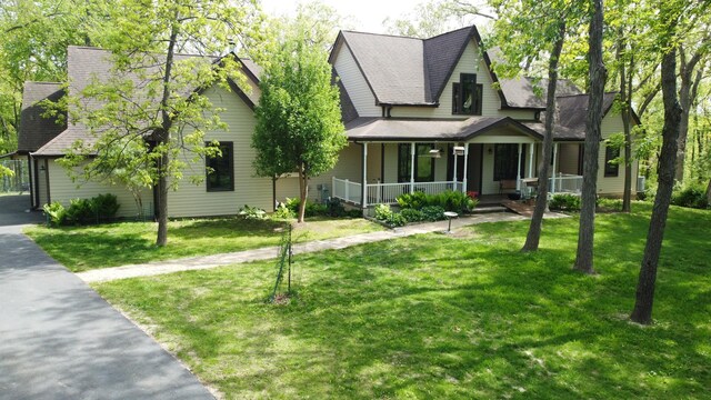 24-114 Lake Carroll Blvd, Lake Carroll, IL 61046 - view of front of property with a porch, a front yard, and roof with shingles