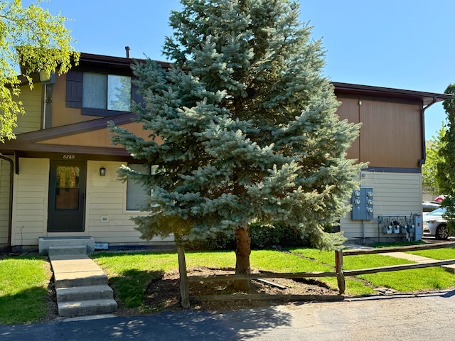 view of front of home with a front yard
