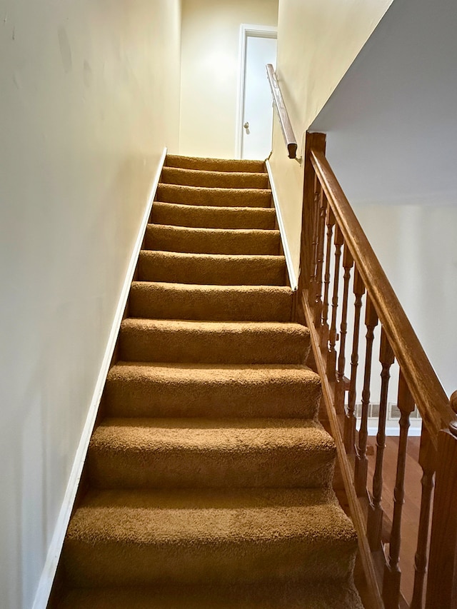 staircase with baseboards