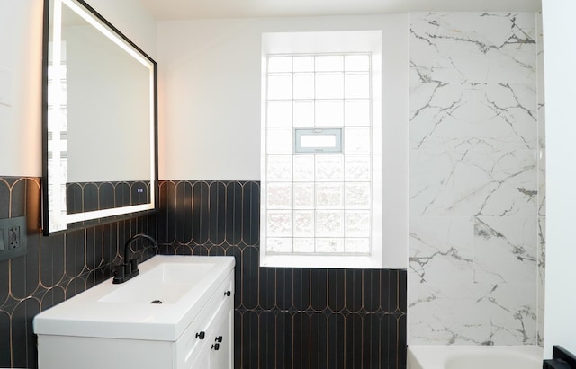 6110 S Saint Lawrence Ave, Chicago, IL 60637 - full bathroom featuring tile walls, vanity, a wainscoted wall, healthy amount of natural light, and shower / bath combination