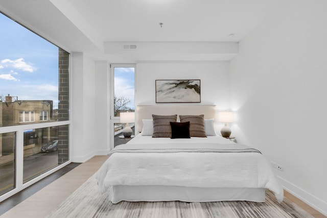 3204 N Kostner Ave Unit 307, Chicago, IL 60618 - bedroom with wood finished floors and baseboards