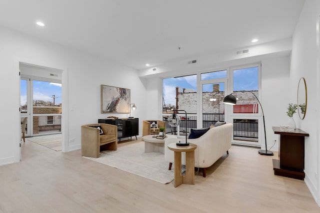 3204 N Kostner Ave Unit 307, Chicago, IL 60618 - living area featuring wood finished floors, recessed lighting, and baseboards