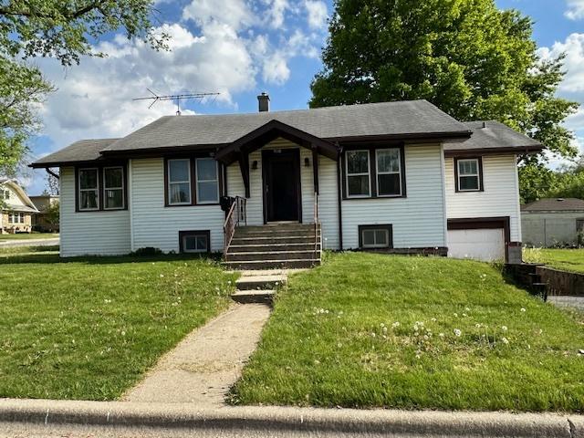 301 S Hebbard St, Joliet, IL 60433 - view of front of house with an attached garage and a front yard