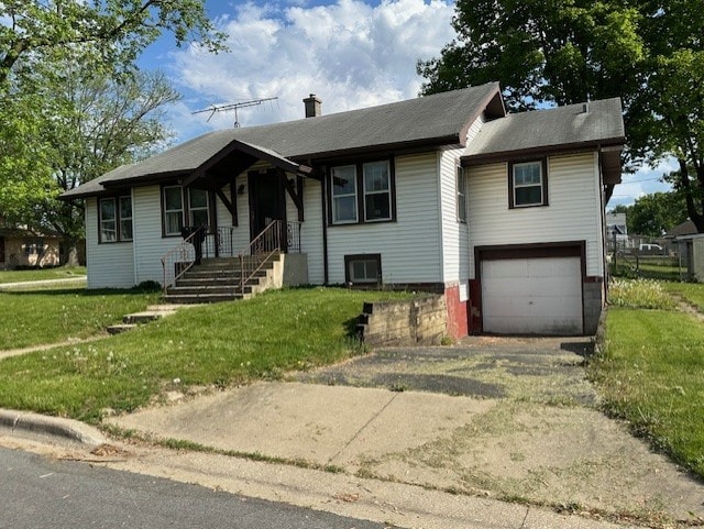 301 S Hebbard St, Joliet, IL 60433 - view of front of home with an attached garage, a chimney, driveway, and a front lawn