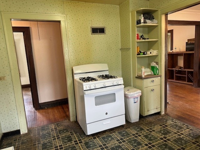 301 S Hebbard St, Joliet, IL 60433 - kitchen featuring white range with gas cooktop, wallpapered walls, and dark wood finished floors