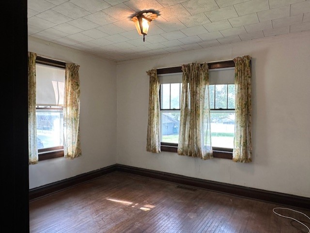 301 S Hebbard St, Joliet, IL 60433 - unfurnished room featuring hardwood / wood-style flooring and baseboards