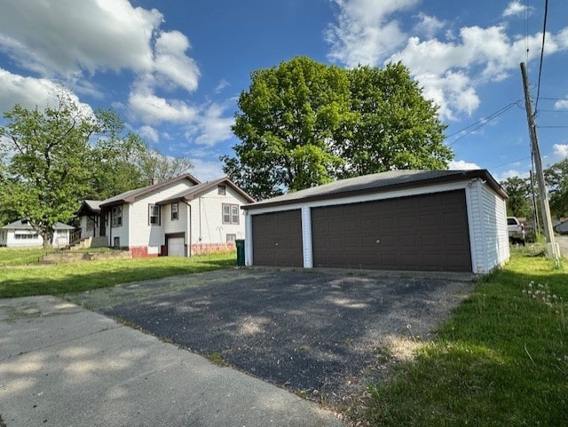 301 S Hebbard St, Joliet, IL 60433 - view of front of house featuring a detached garage and an outdoor structure