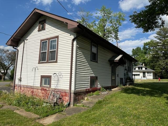 301 S Hebbard St, Joliet, IL 60433 - back of house with a yard