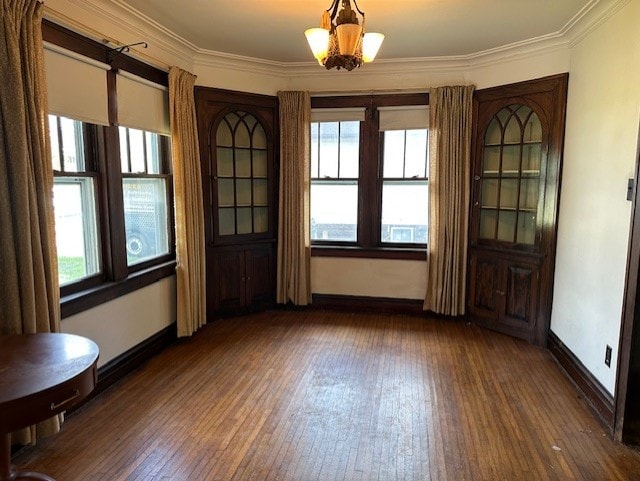 301 S Hebbard St, Joliet, IL 60433 - empty room with baseboards, wood-type flooring, plenty of natural light, and ornamental molding