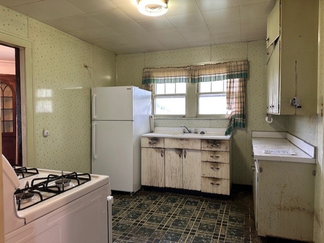 301 S Hebbard St, Joliet, IL 60433 - kitchen featuring white appliances, light countertops, and wallpapered walls