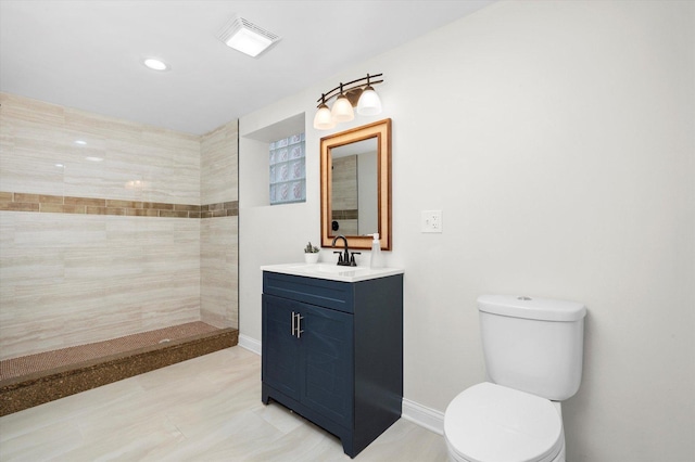 8214 S Paxton Ave, Chicago, IL 60617 - bathroom featuring toilet, walk in shower, vanity, recessed lighting, and baseboards