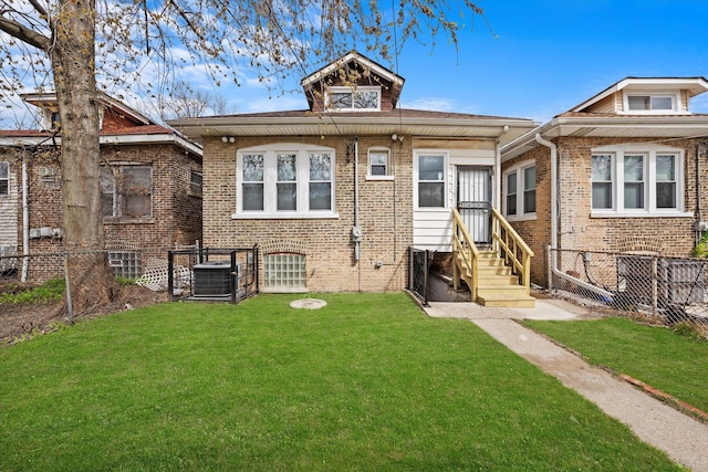 8214 S Paxton Ave, Chicago, IL 60617 - back of house featuring cooling unit, brick siding, and entry steps