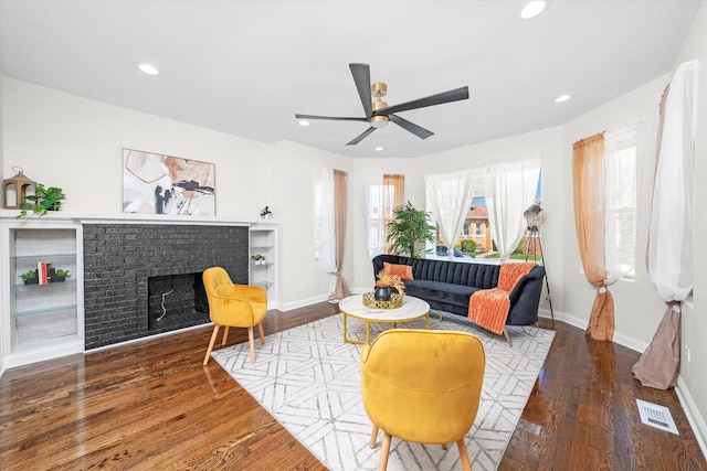 8214 S Paxton Ave, Chicago, IL 60617 - living area featuring wood finished floors, ceiling fan, baseboards, a fireplace, and recessed lighting
