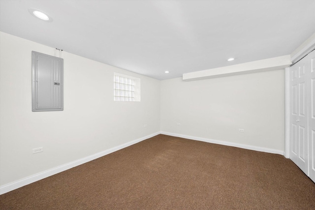 8214 S Paxton Ave, Chicago, IL 60617 - below grade area with electric panel, dark carpet, baseboards, and recessed lighting