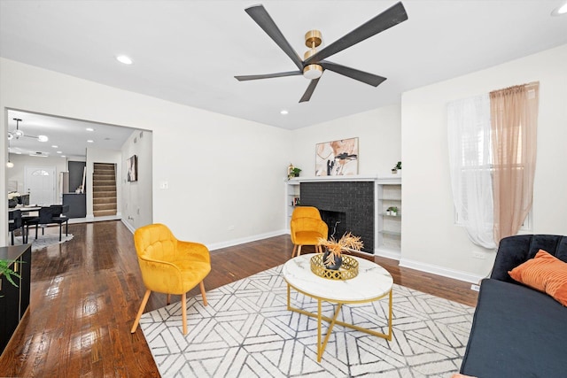 8214 S Paxton Ave, Chicago, IL 60617 - living area with ceiling fan, a fireplace, stairway, wood finished floors, and recessed lighting