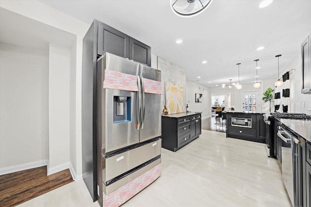 8214 S Paxton Ave, Chicago, IL 60617 - kitchen with stainless steel refrigerator with ice dispenser, dark cabinetry, built in microwave, recessed lighting, and baseboards