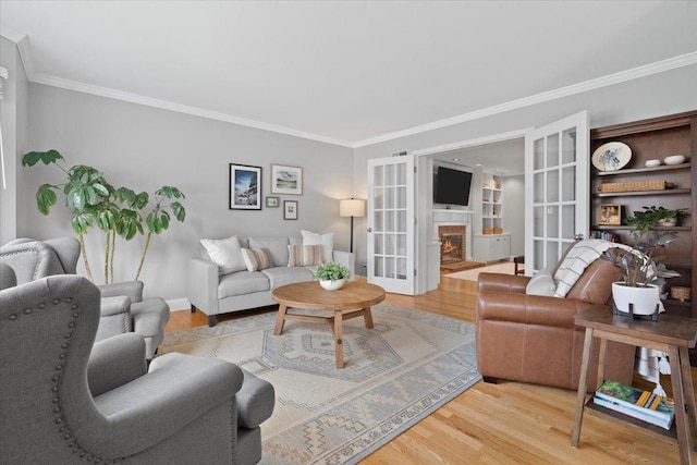 519 Long Hill Rd, Gurnee, IL 60031 - living room with ornamental molding, wood finished floors, a warm lit fireplace, and baseboards