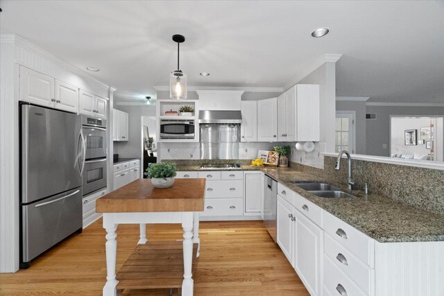 519 Long Hill Rd, Gurnee, IL 60031 - kitchen featuring stainless steel appliances, a sink, ornamental molding, white cabinets, and pendant lighting